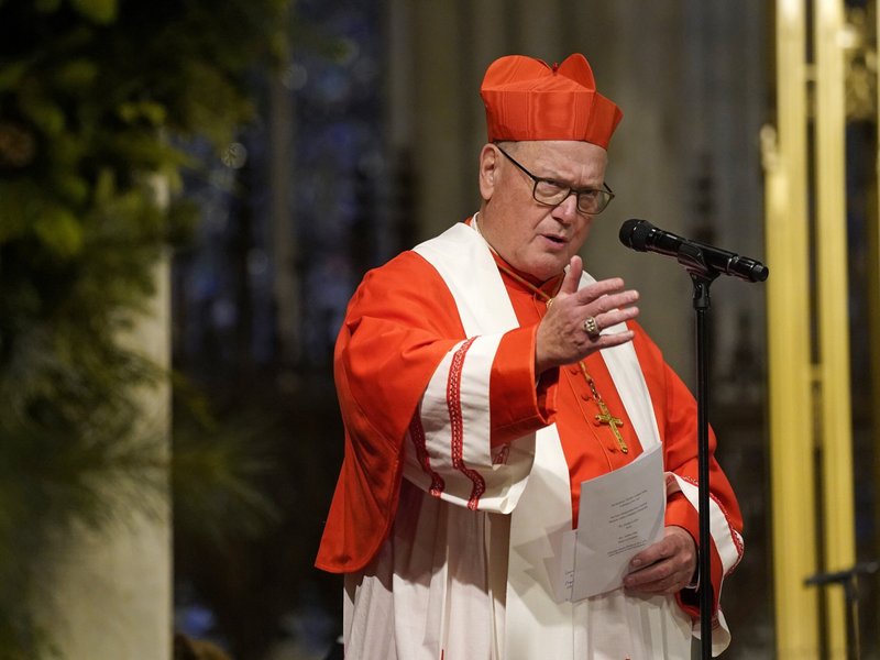 Cardinal Dolan Reproaches Anti-Migrant Protestors at Closed Catholic School Site