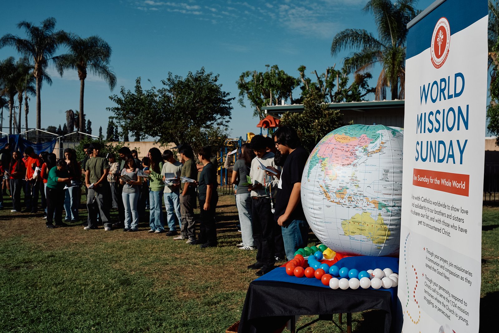Confirmation students participate in the World Mission Rosary during a World Mission Sunday event on Oct. 18 at Our Lady of the Rosary Church in Paramount.