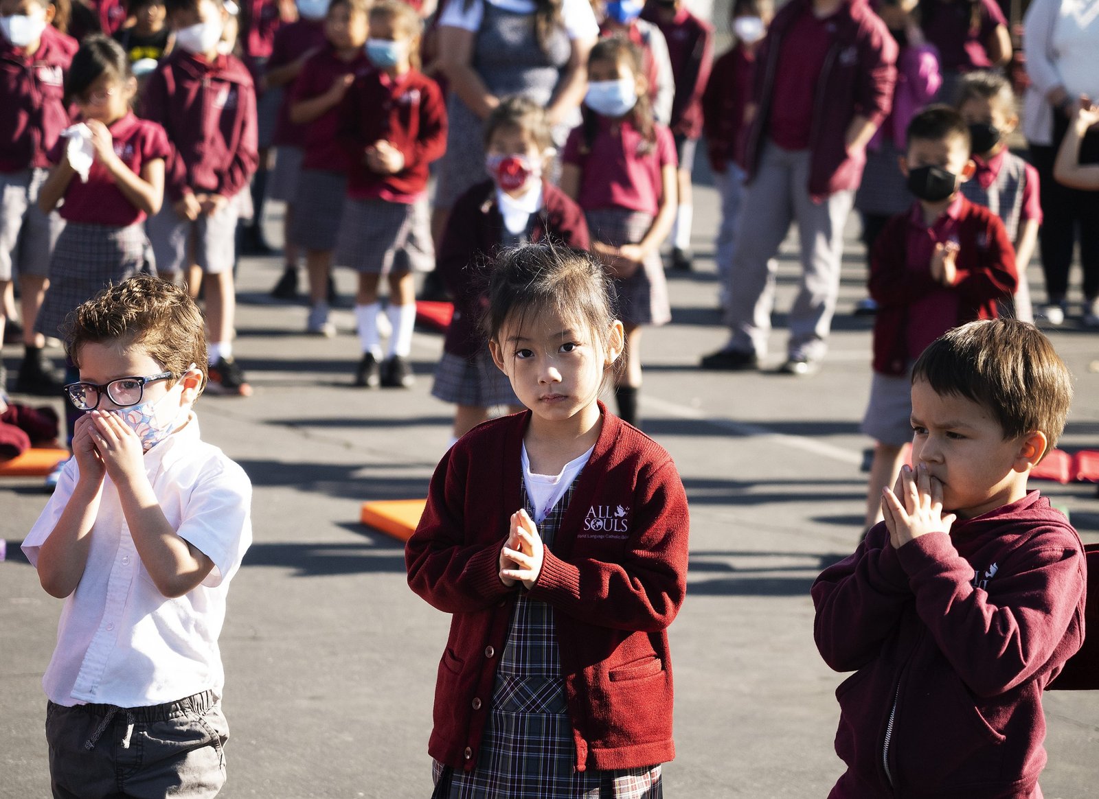 Students pray at All Souls World Language School in Alhambra. (Victor Alemán)