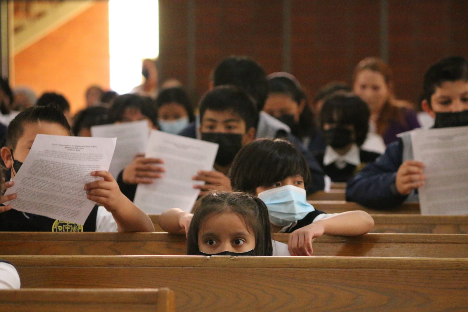 Students pray at St. Anthony of Padua school. (Pablo Kay)