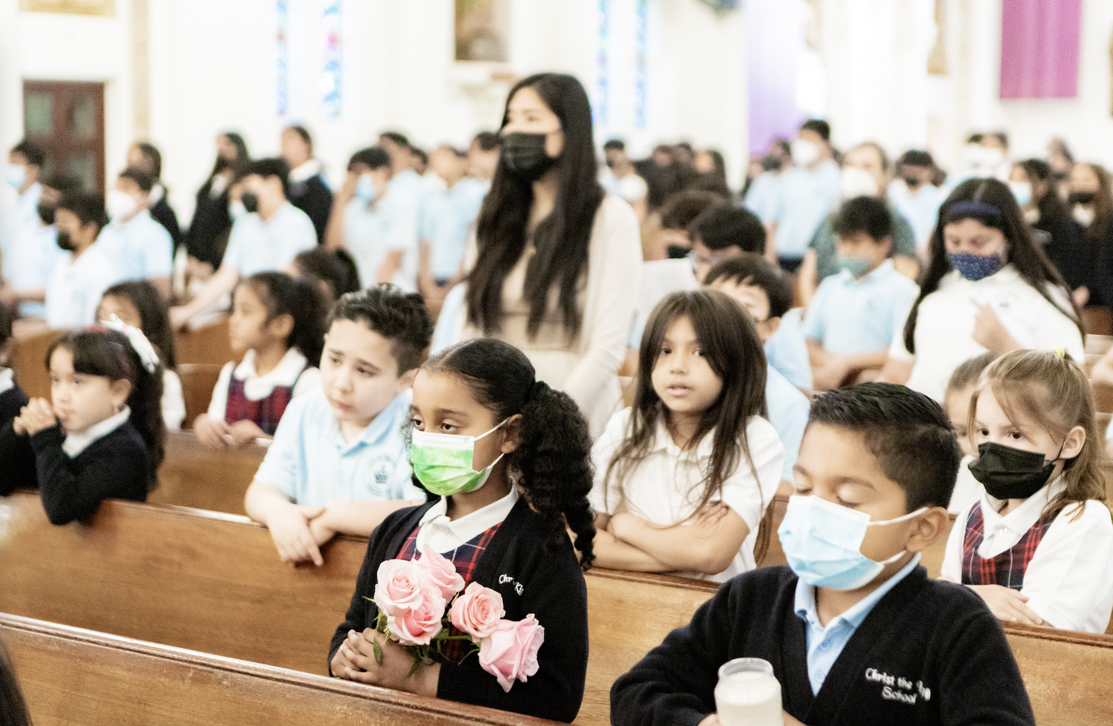 Students at Christ the King School in Los Angeles pray during the school-wide Mass to join Pope Francis in prayer for Russia and Ukraine. (Ron Echual)
