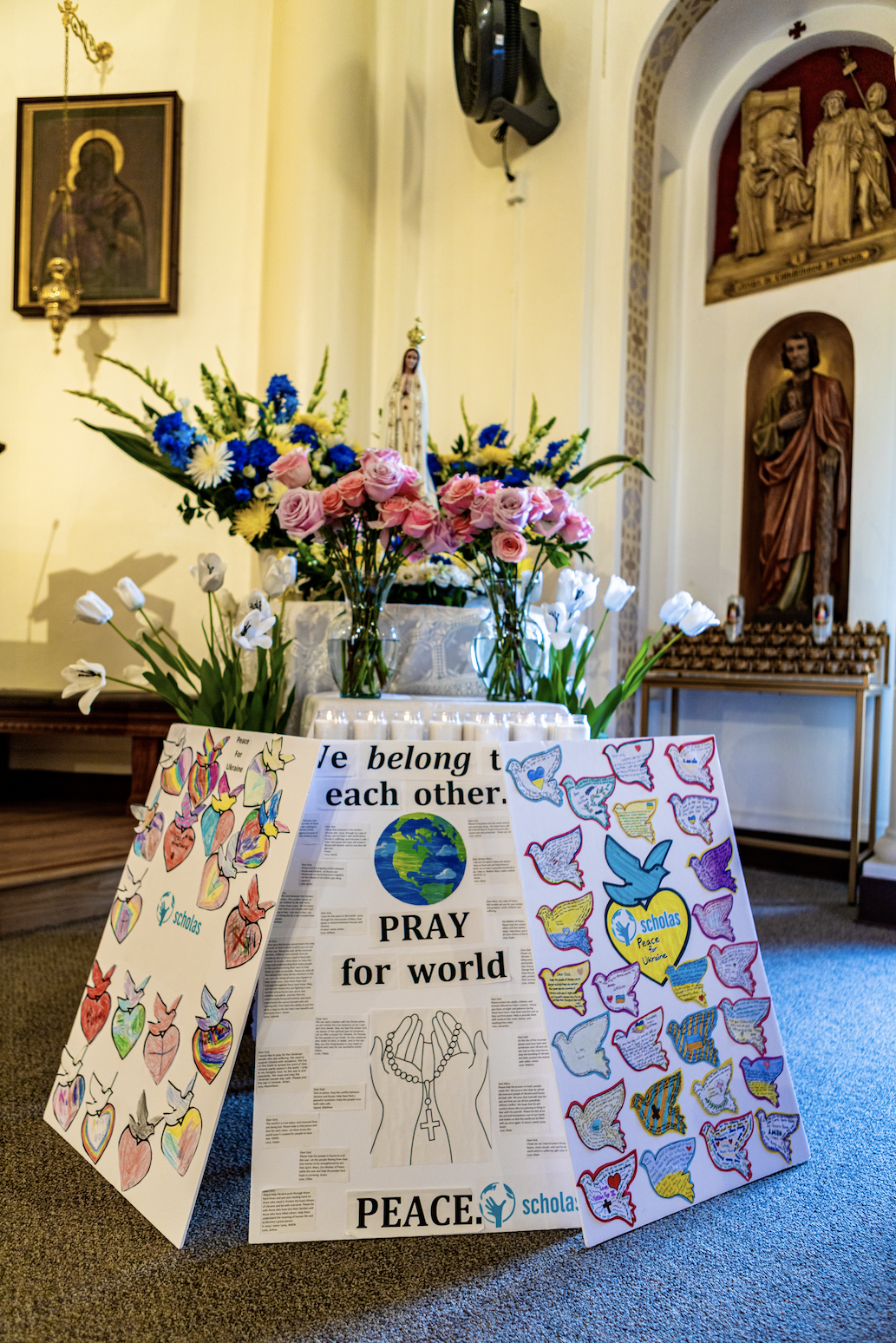 Christ the King students left prayers for peace and flowers at the school's statue of the Virgin Mary. (Ron Echual)