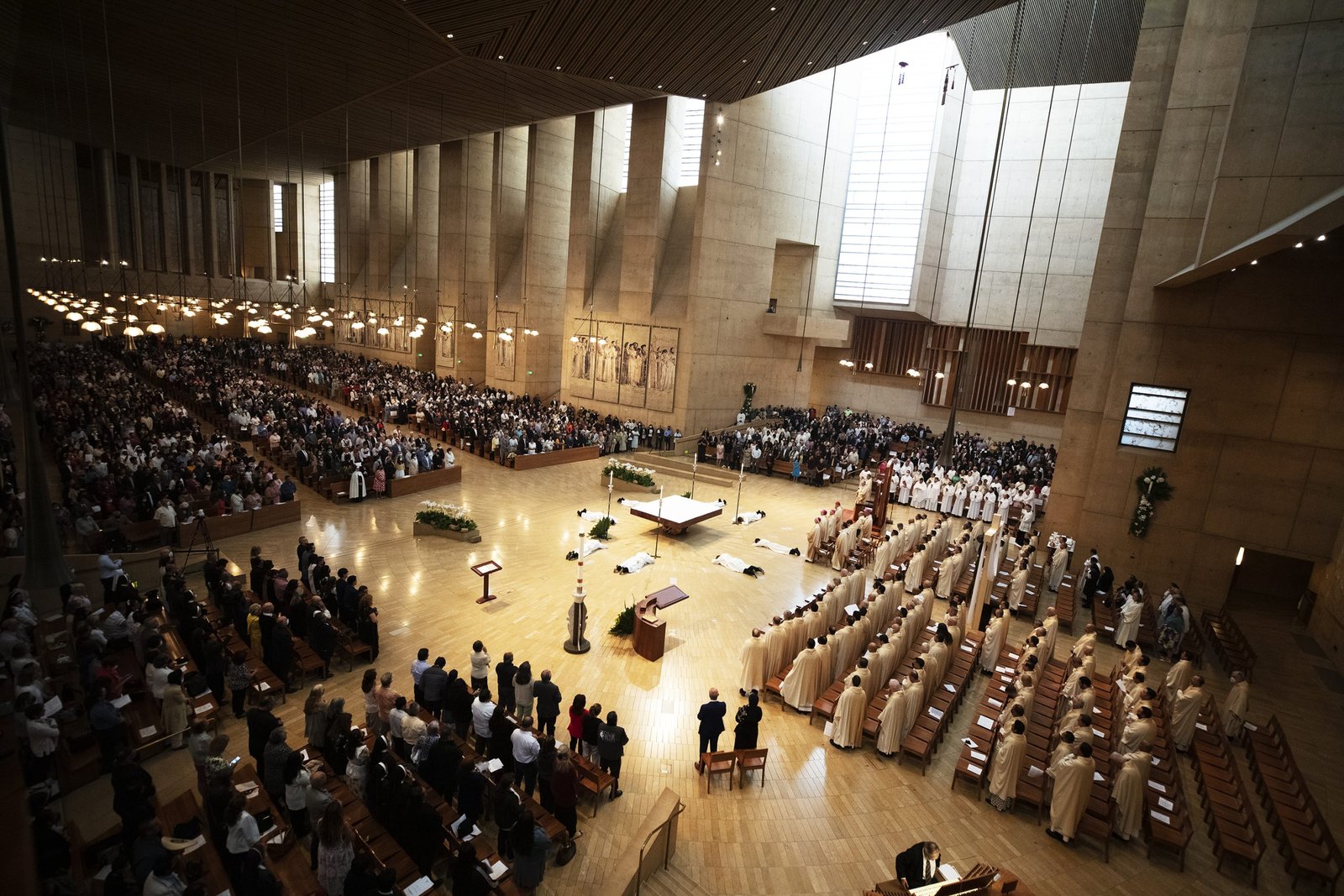 The eight soon-to-be priests lay prostrate as the Litany of the Saints is sung during the Rite of Ordination. (Victor Alemán)
