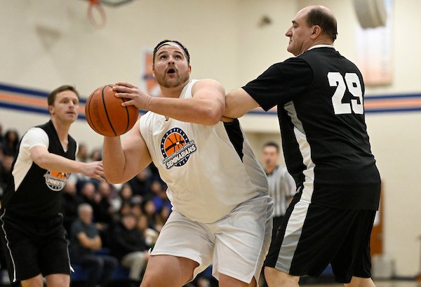 MVP Tommy Green goes for a basket during the Feb. 17, 2023, Priests vs. Seminarians basketball game. (John McCoy)