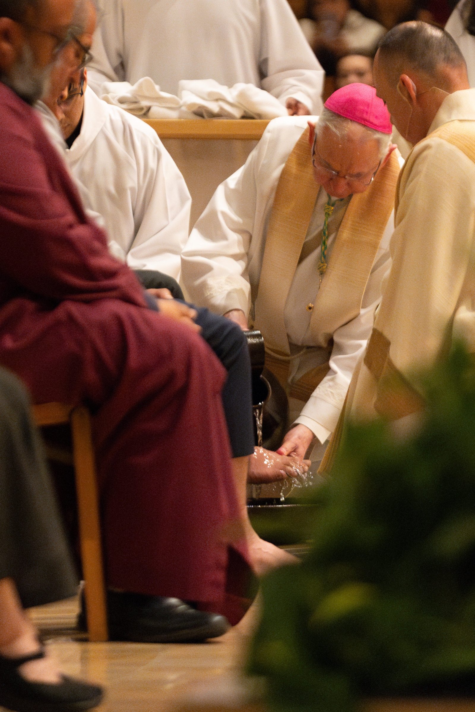 Archbishop José H. Gomez washes the feet of parishioners during the Mass of the Lord’s Supper at the Cathedral of Our Lady of the Angels on April 17. (Will Jobe)