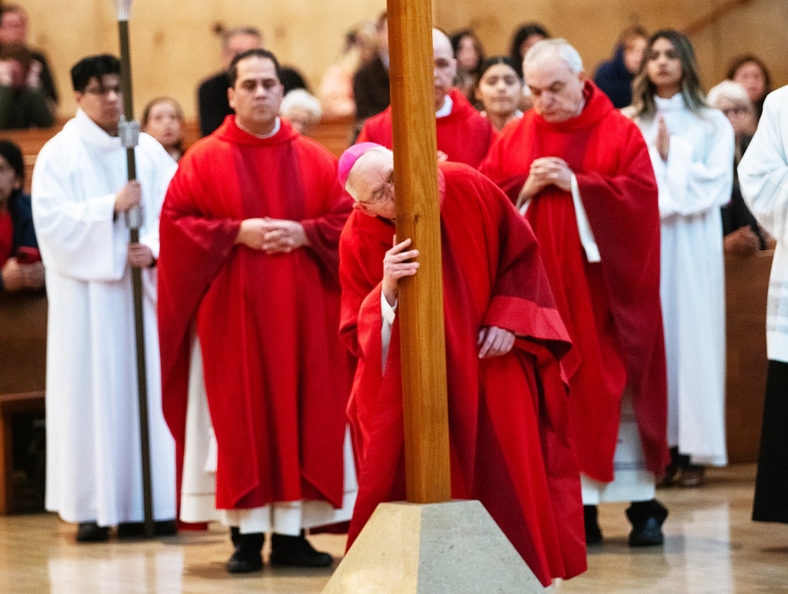 Archbishop José H. Gomez kisses the cross during a Good Friday liturgy at the Cathedral of Our Lady of the Angels on April 18. (Victor Alemán)