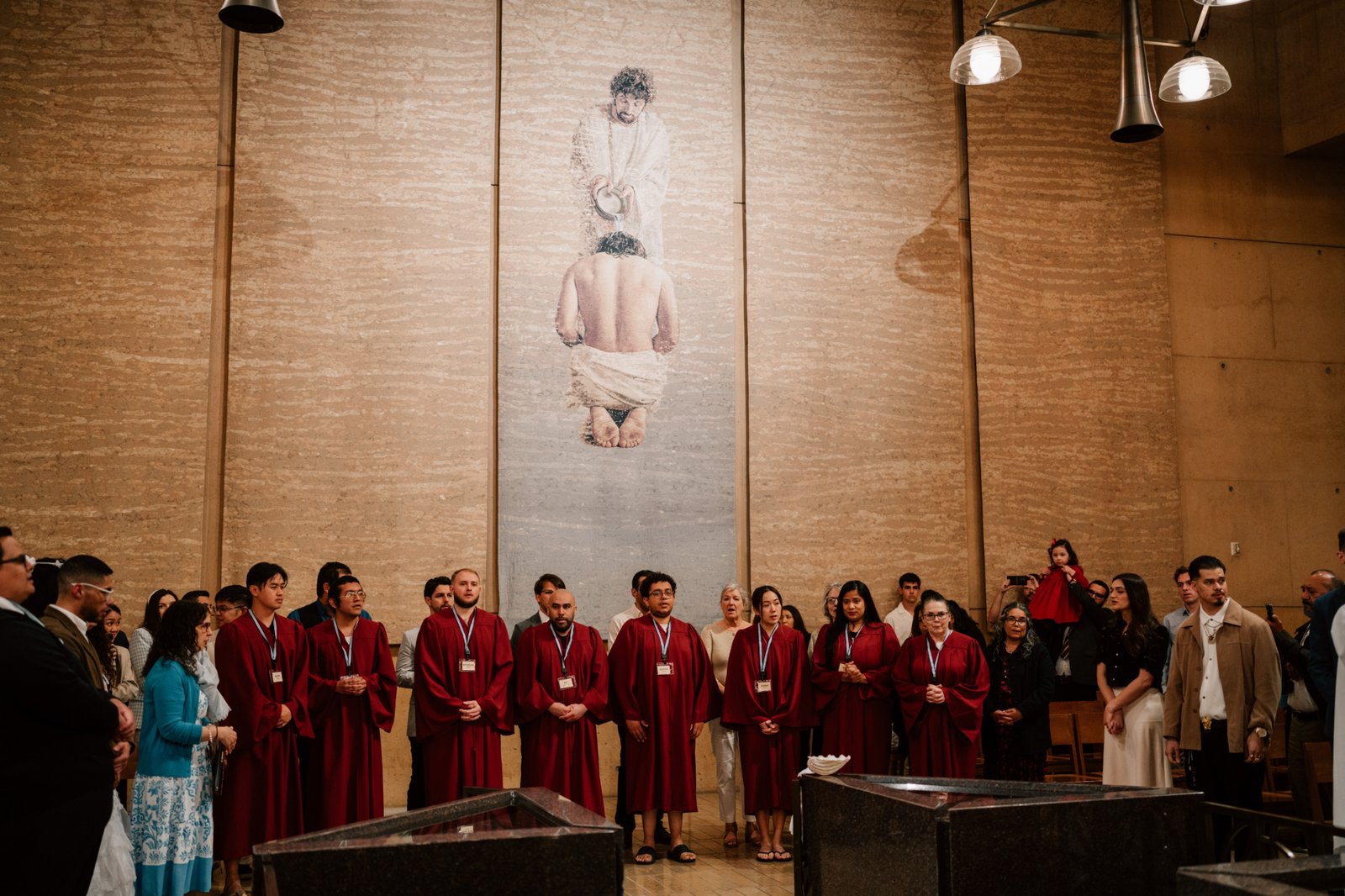 Catechumens ready to be baptized into the Church stand at the Cathedral of Our Lady of the Angels during the Easter Vigil Mass on April 19. (Peter Lobato)