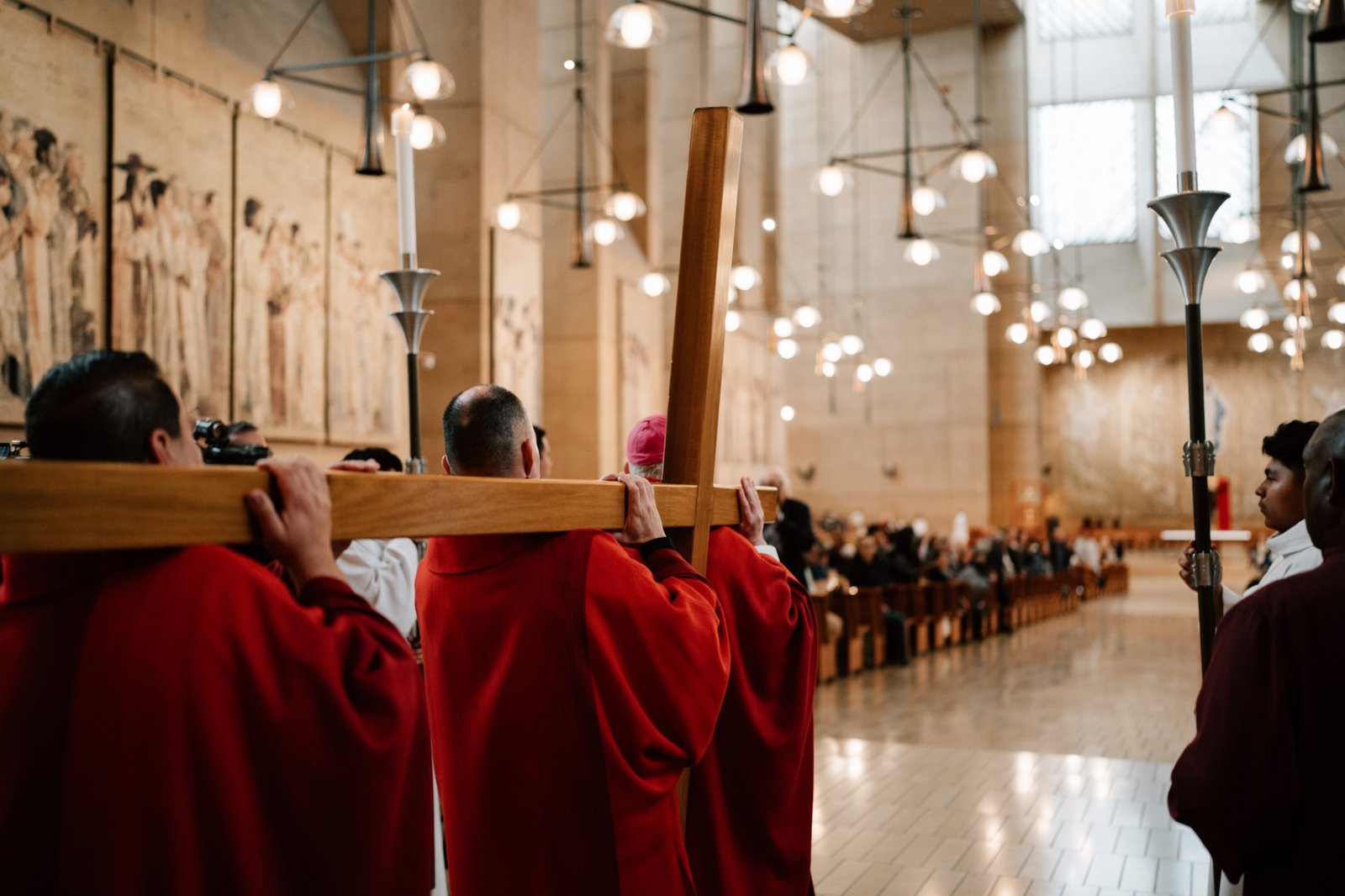 Archbishop José H. Gomez leads other priests in carrying the cross during a Good Friday liturgy at the Cathedral of Our Lady of the Angels on April 18. (Peter Lobato)