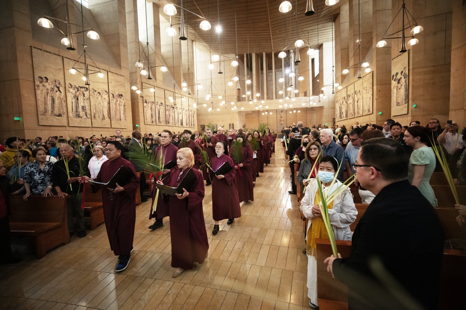 The choir processes into the Cathedral of Our Lady of the Angels at the beginning of Palm Sunday Mass on April 13. (Victor Alemán)