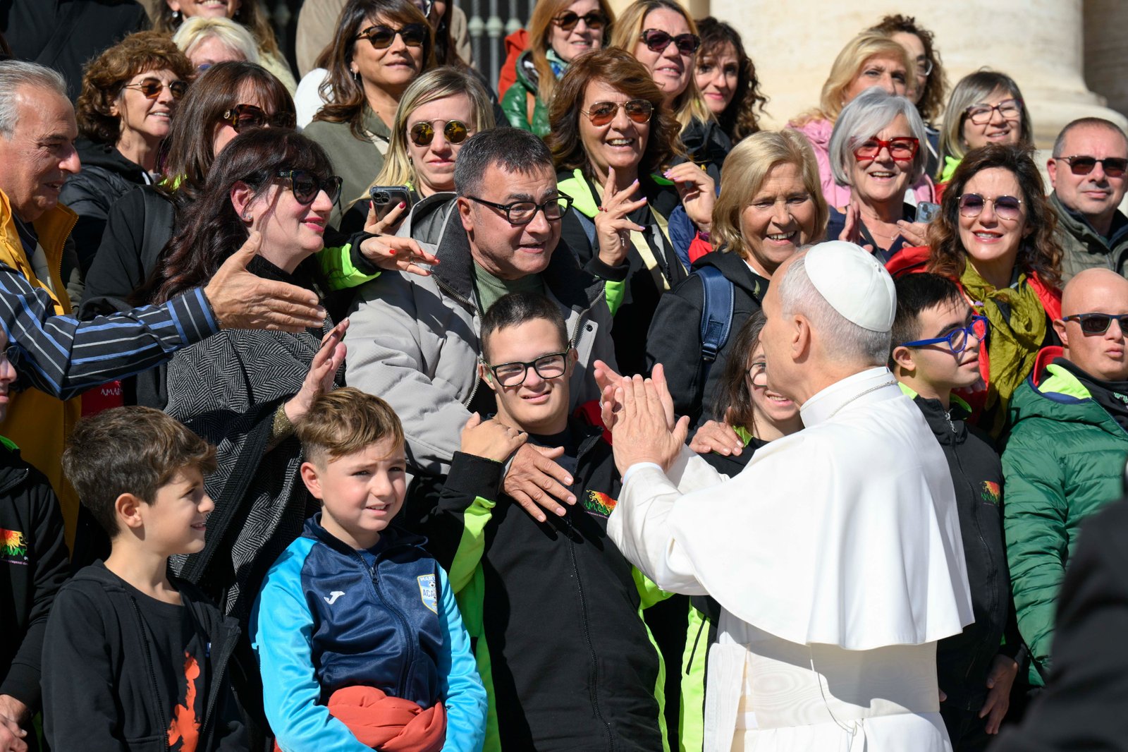 Pope Leo XIV greets a group of pilgrims at the end of an audience for the Jubilee of Migrants and the Jubilee of the Missions Oct. 4, 2025, in St. Peter's Square at the Vatican. (CNS photo/Vatican Media)