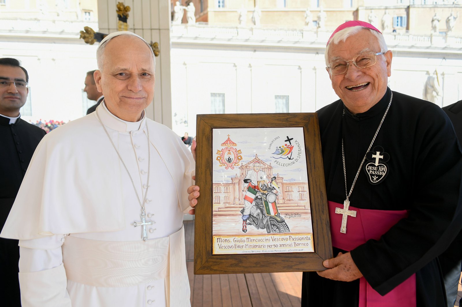 Pope Leo XIV poses for a photo with retired Bishop Giulio Mencuccini of Sanggau, Indonesia, after an audience for the Jubilee of Migrants and the Jubilee of the Missions Oct. 4, 2025. The bishop is known in Italy as the "Missionary Biker Bishop" because he spent decades traveling around rural Indonesia on a motorcycle to carry out his ministry. (CNS photo/Vatican Media)
