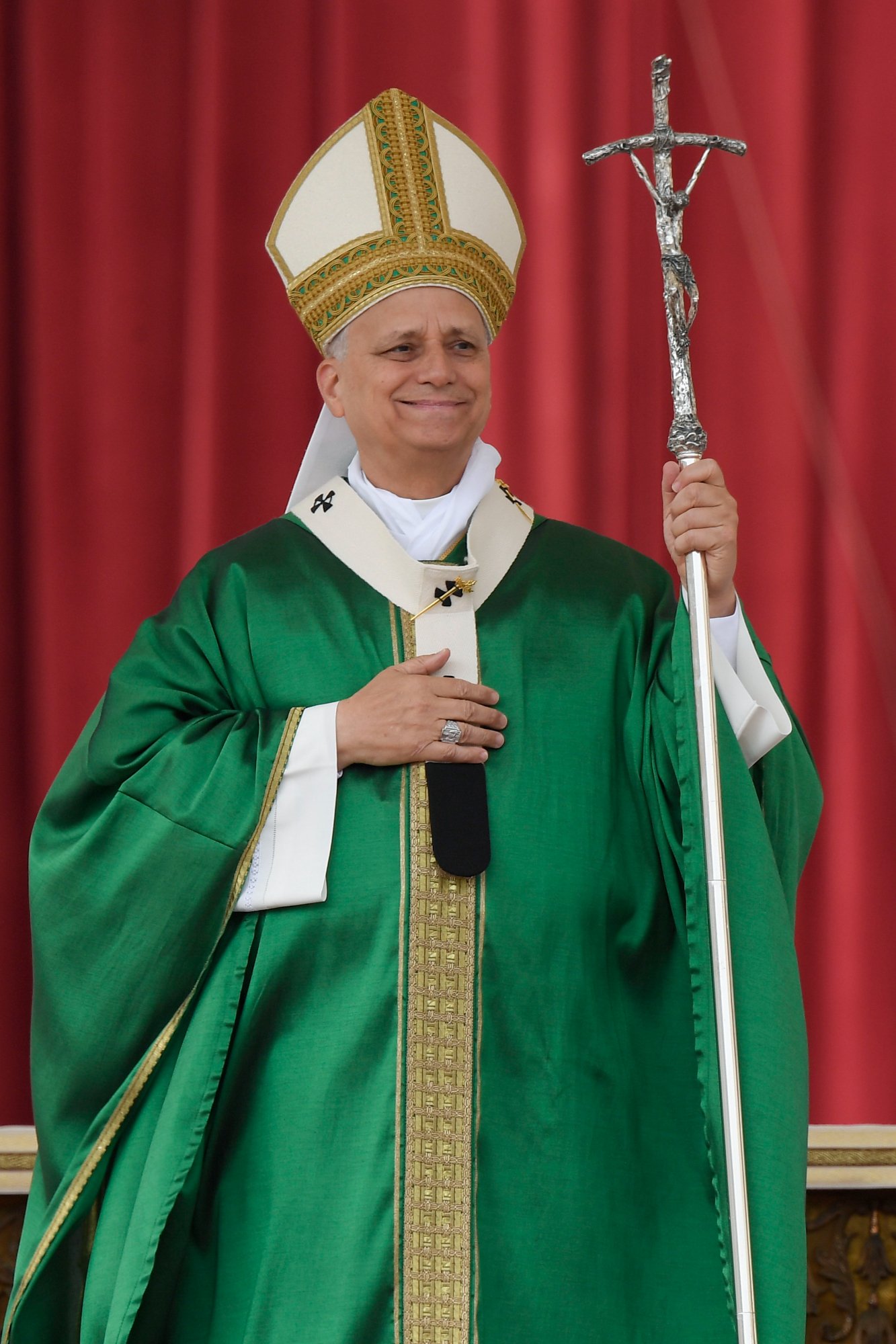 Pope Leo XIV smiles as he arrives for Mass for the Jubilee of Migrants and the Jubilee of the Missions in St. Peter’s Square at the Vatican Oct. 5, 2025. (CNS photo/Vatican Media)