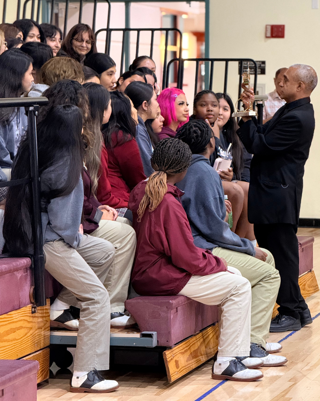 Msgr. Anthony Figueiredo, a priest in Assisi, Italy, displays the relics of St. Carlo Acutis to students at Bishop Conaty - Our Lady of Loretto High School on Oct. 21 during a tour of the saint's relics. (Bishop Conaty - Our Lady of Loretto High School)