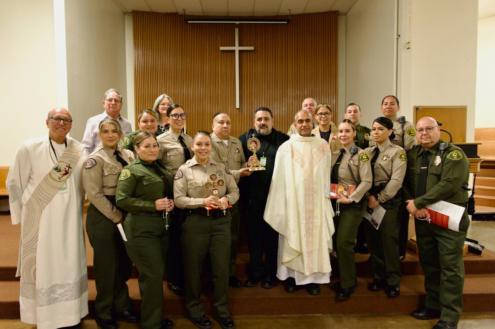 Msgr. Anthony Figueiredo, center, right, poses with sheriff's deputies and staff during St. Carlo Acutis' relic visit to LA Men’s Central Jail on Oct. 20. (Reese Cuevas)