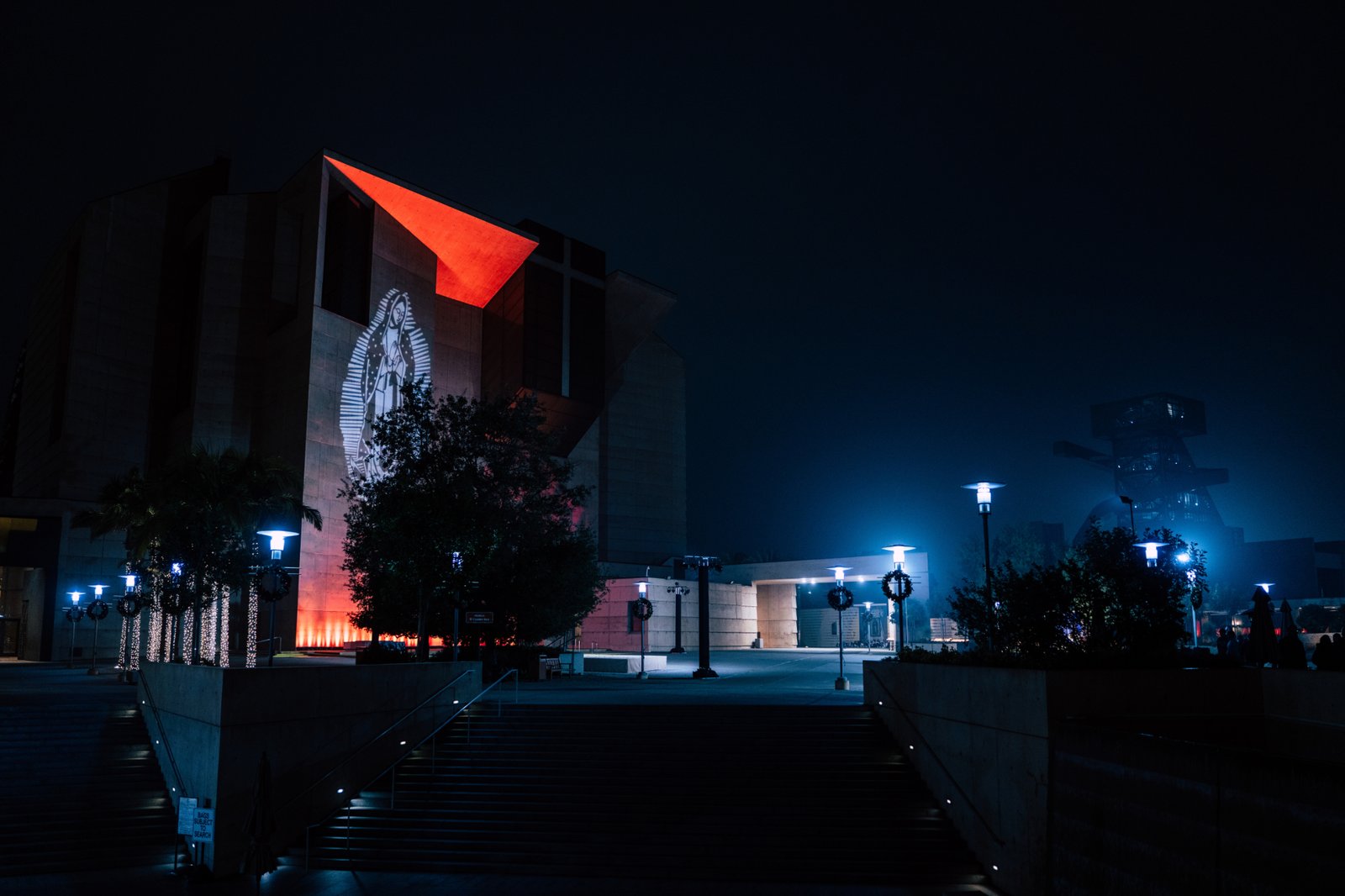 The glow of Our Lady of Guadalupe shines during the early morning hours of the annual Adopt-a-Family LA gift distribution event on Dec. 13 at the Cathedral of Our Lady of the Angels. (Peter Lobato)