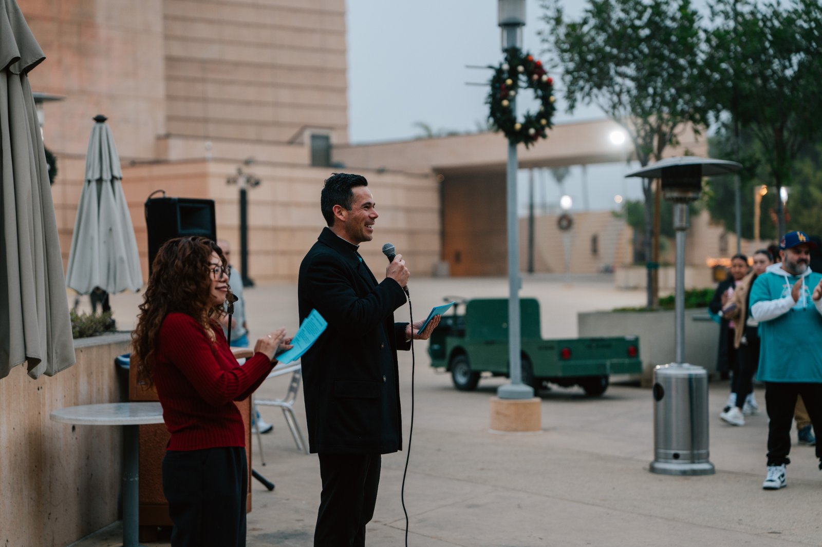 Father Michael Mesa addresses volunteers during the annual Adopt-a-Family LA gift distribution event on Dec. 13 at the Cathedral of Our Lady of the Angels. (Peter Lobato)