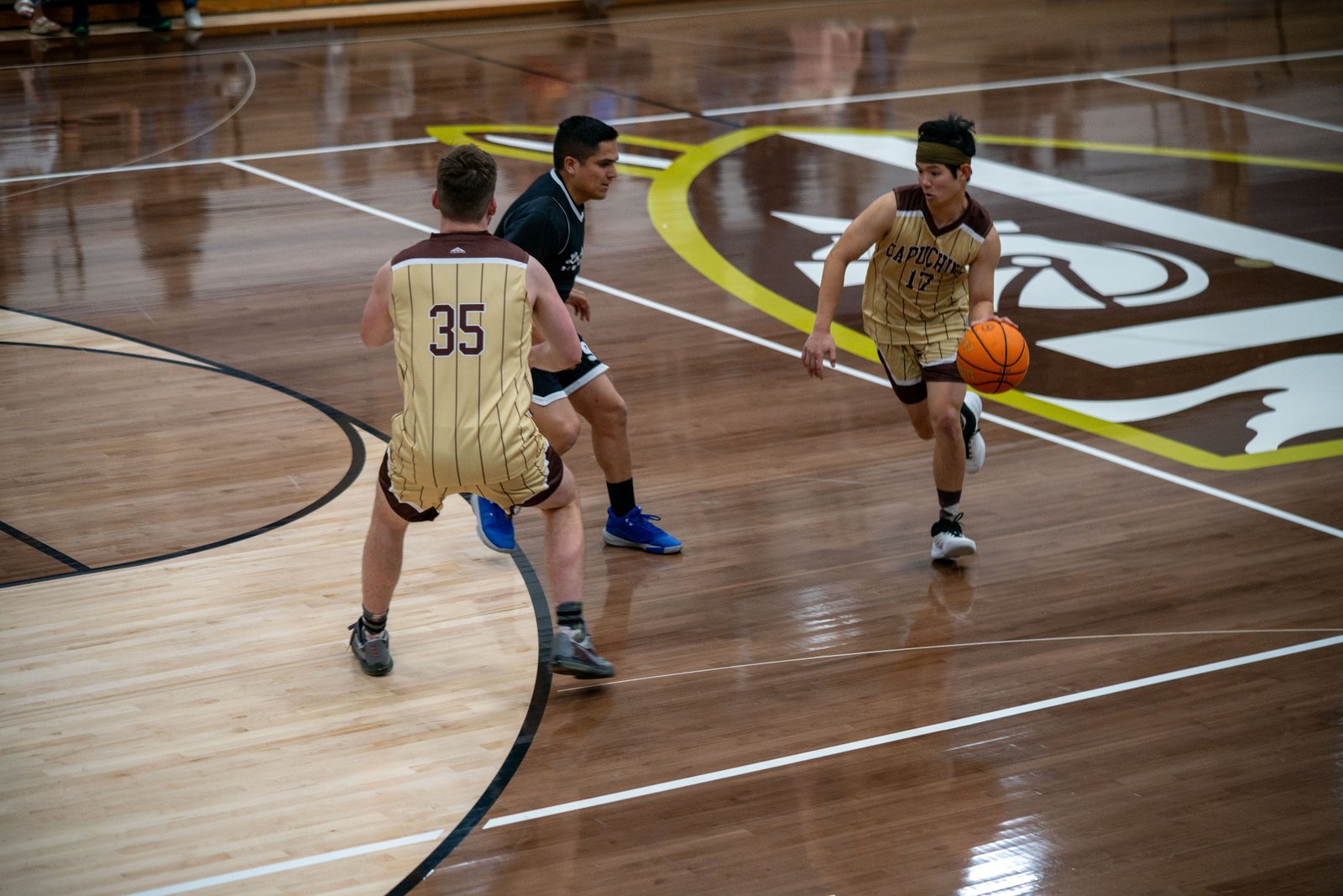 Game action as the Capuchin Franciscans play against the seminarians in the Archdiocese of Los Angeles' annual priests vs. seminarians basketball game, this year on Jan. 18 at St. Francis High School in La Cañada Flintridge. (John Rueda)