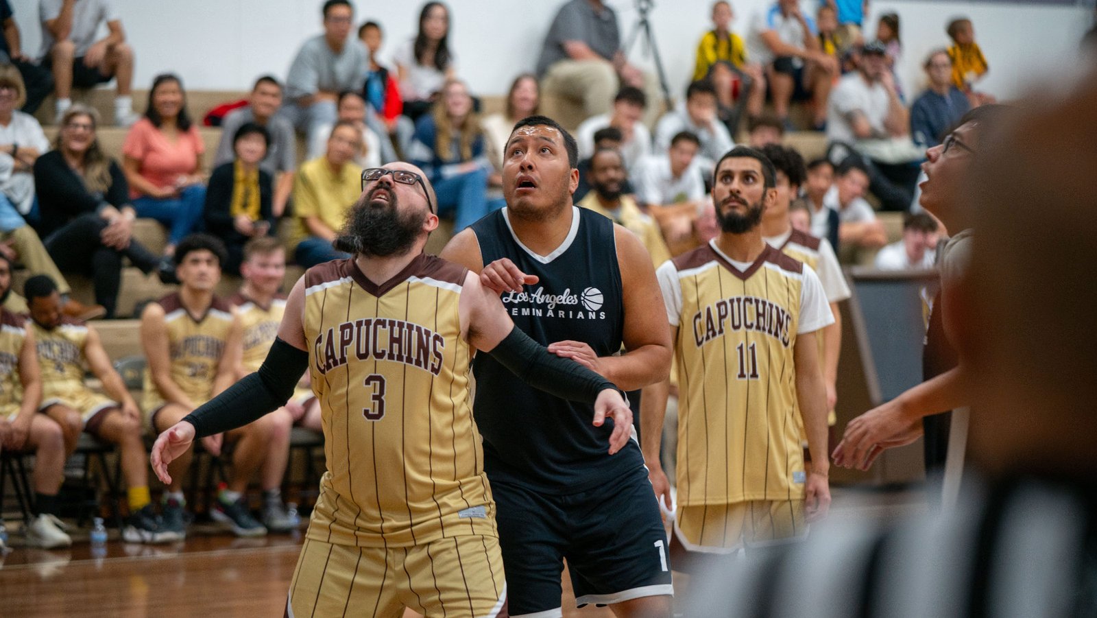 Game action as the Capuchin Franciscans play against the seminarians in the Archdiocese of Los Angeles' annual priests vs. seminarians basketball game, this year on Jan. 18 at St. Francis High School in La Cañada Flintridge. (John Rueda)