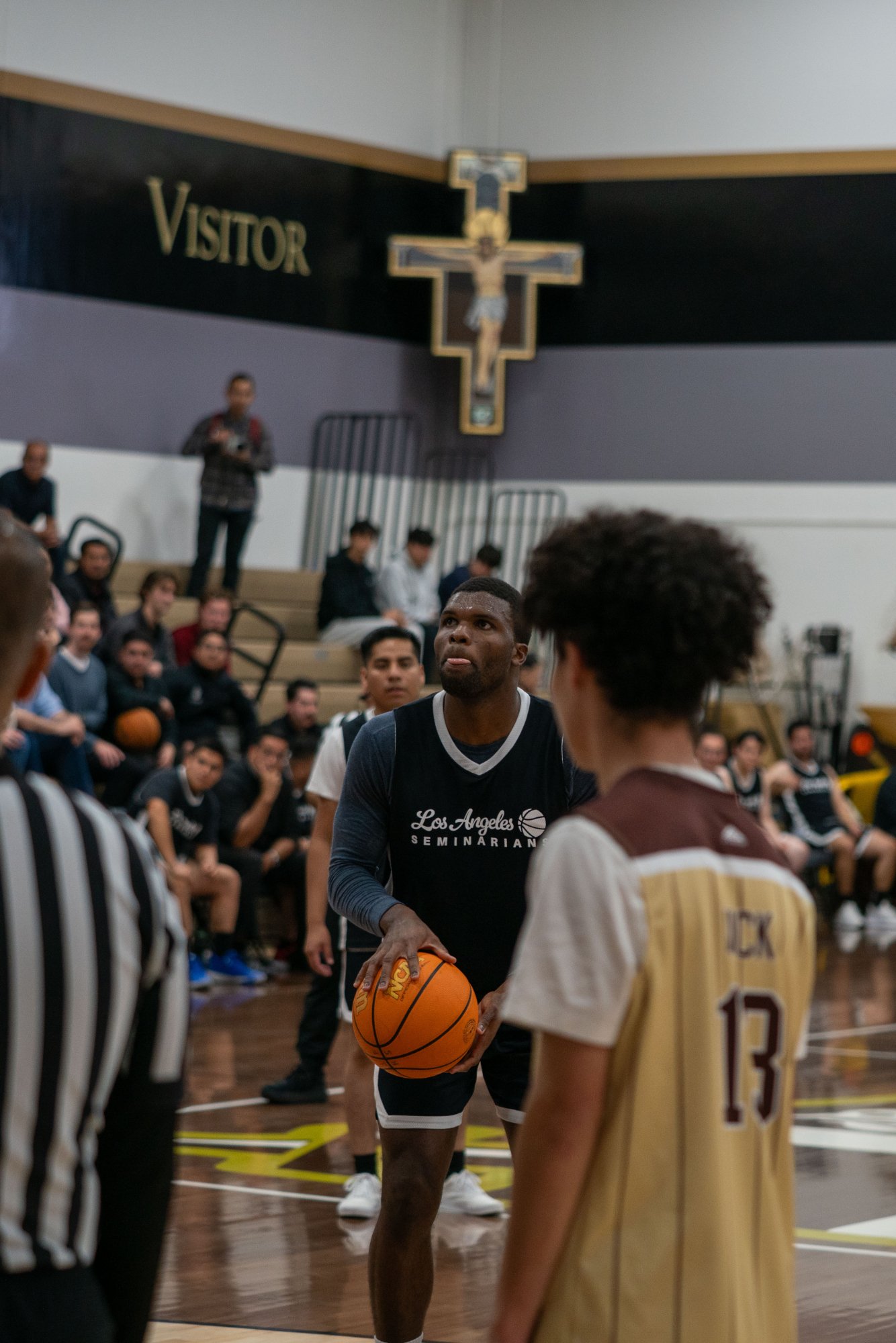 Game action as the Capuchin Franciscans play against the seminarians in the Archdiocese of Los Angeles' annual priests vs. seminarians basketball game, this year on Jan. 18 at St. Francis High School in La Cañada Flintridge. (John Rueda)