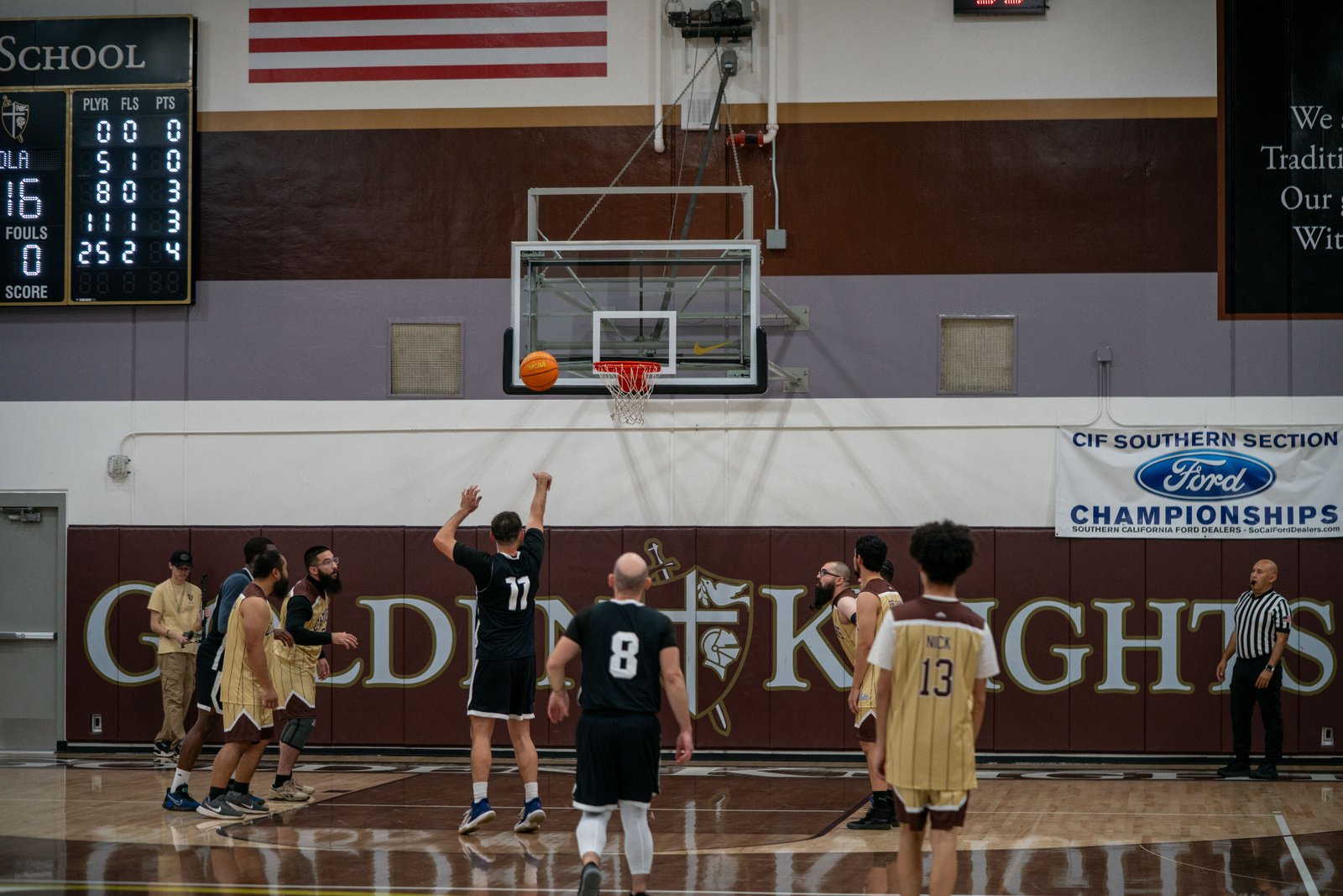 Game action as the Capuchin Franciscans play against the seminarians in the Archdiocese of Los Angeles' annual priests vs. seminarians basketball game, this year on Jan. 18 at St. Francis High School in La Cañada Flintridge. (John Rueda)