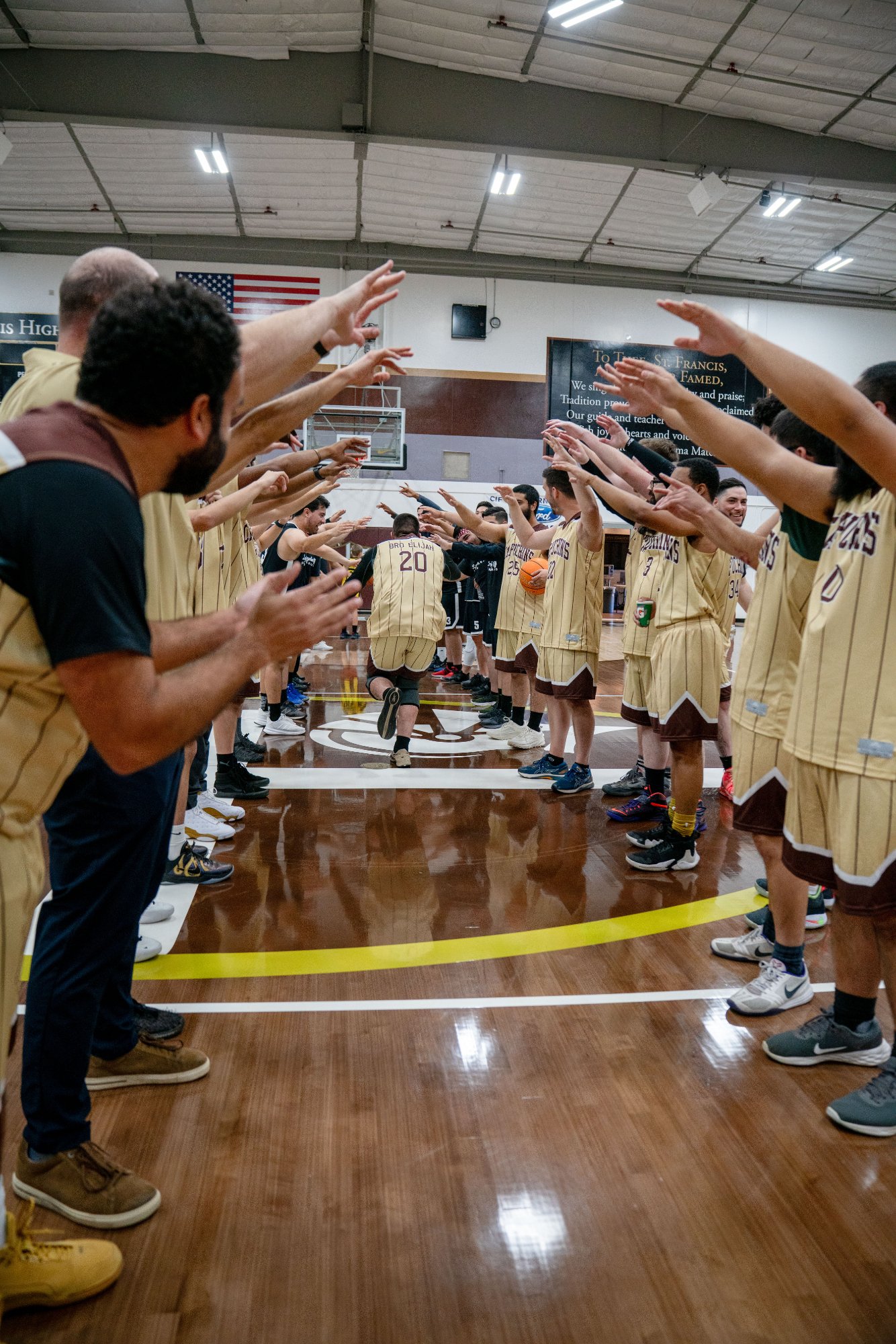 The Capuchin Franciscan members get introduced in their basketball game against the LA seminarians on Jan. 18 at St. Francis High School in La Cañada Flintridge. (John Rueda)