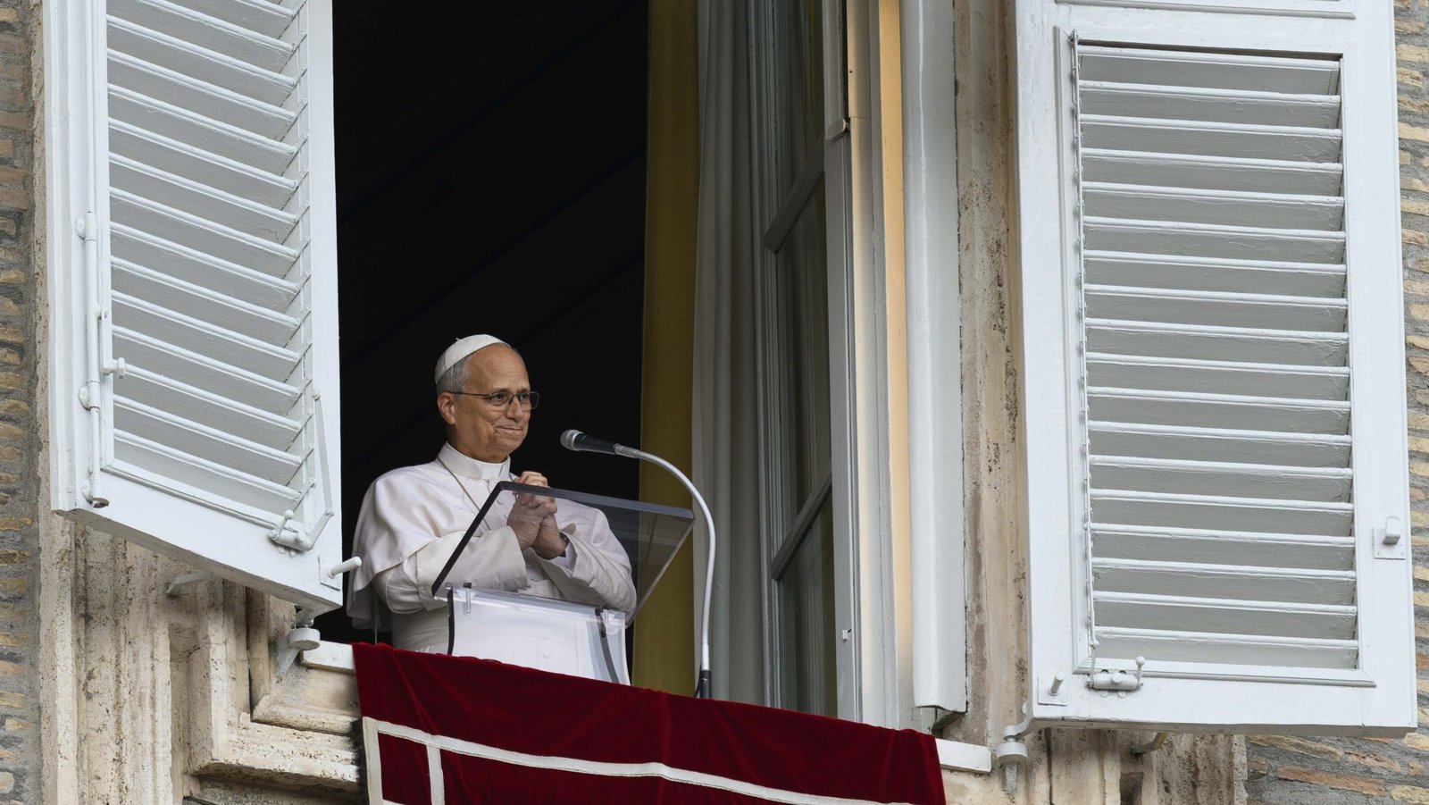 Pope Leo XIV clasps his hands after leading the Angelus in St. Peter's Square at the Vatican Oct. 18, 2026, after being released from the hospital the previous day. (OSV News/Matteo Pernaselci, Vatican Media)
