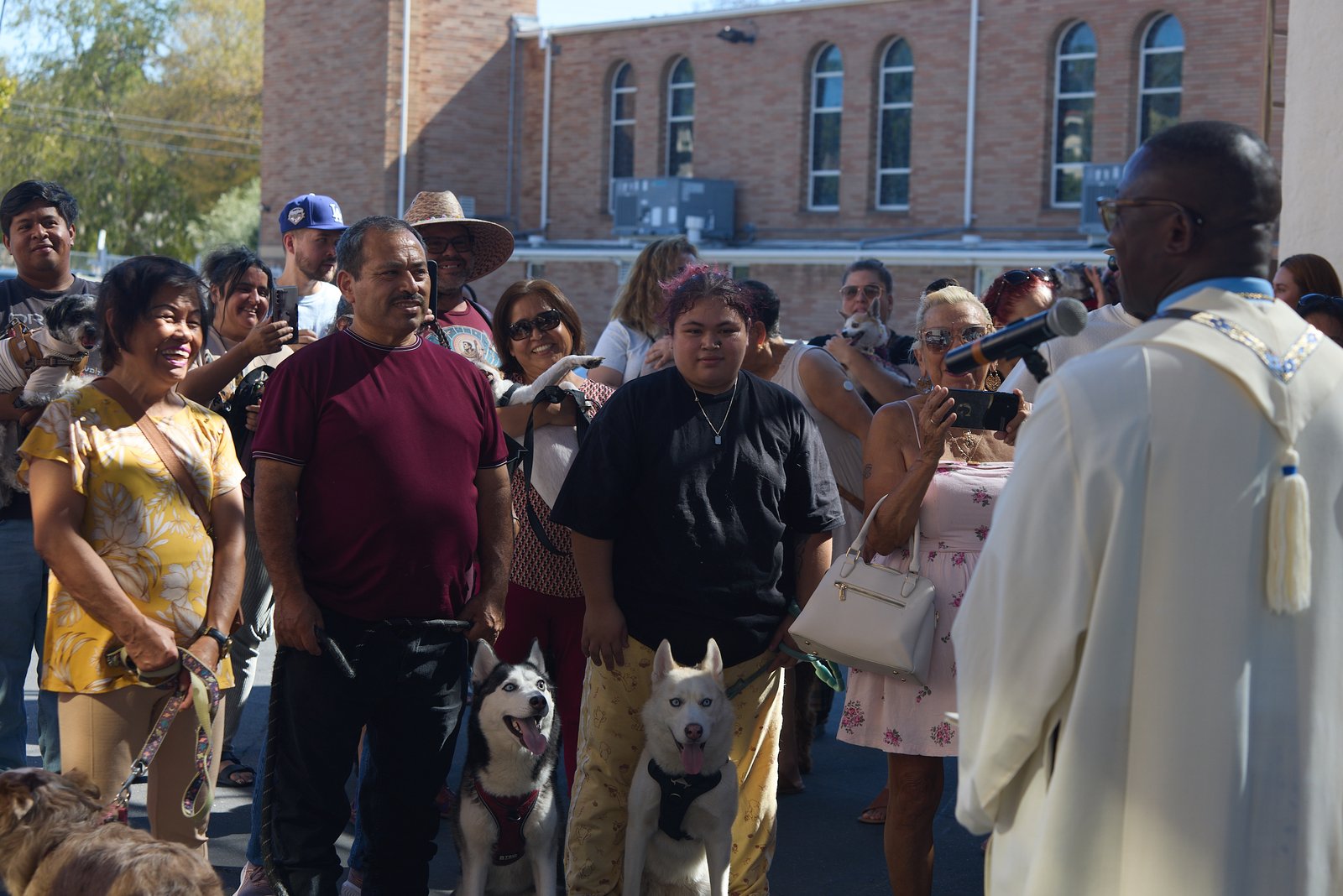 Father Chidi Ekpendu, pastor at St. Francis of Assisi Church in Silver Lake, celebrates the parish patron’s feast day with a special “Blessing of the Animals” after a special Mass and parish potluck on Oct. 4. (John Geronilla)
