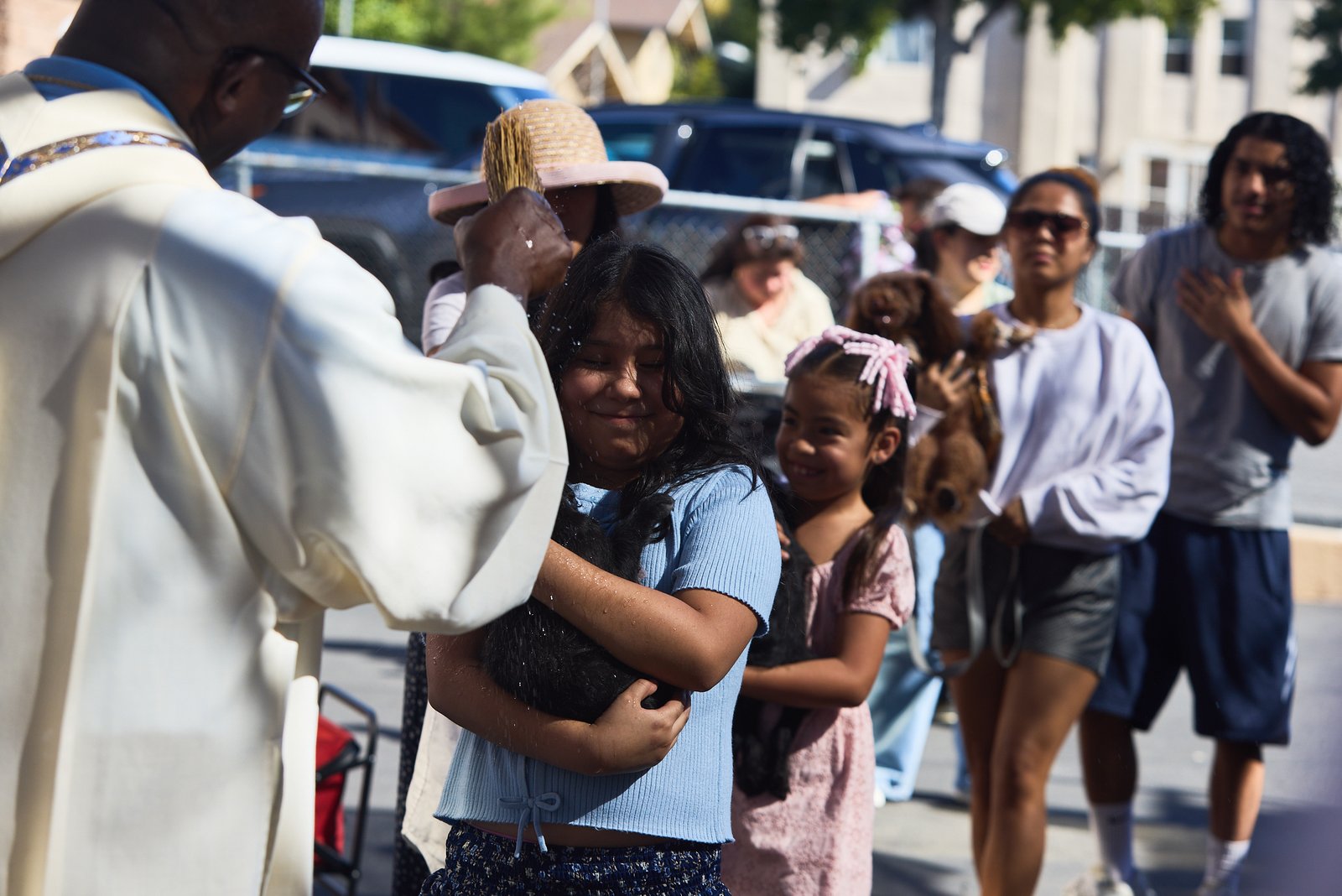 Father Chidi Ekpendu, pastor at St. Francis of Assisi Church in Silver Lake, celebrates the parish patron’s feast day with a special “Blessing of the Animals” after a special Mass and parish potluck on Oct. 4. (John Geronilla)