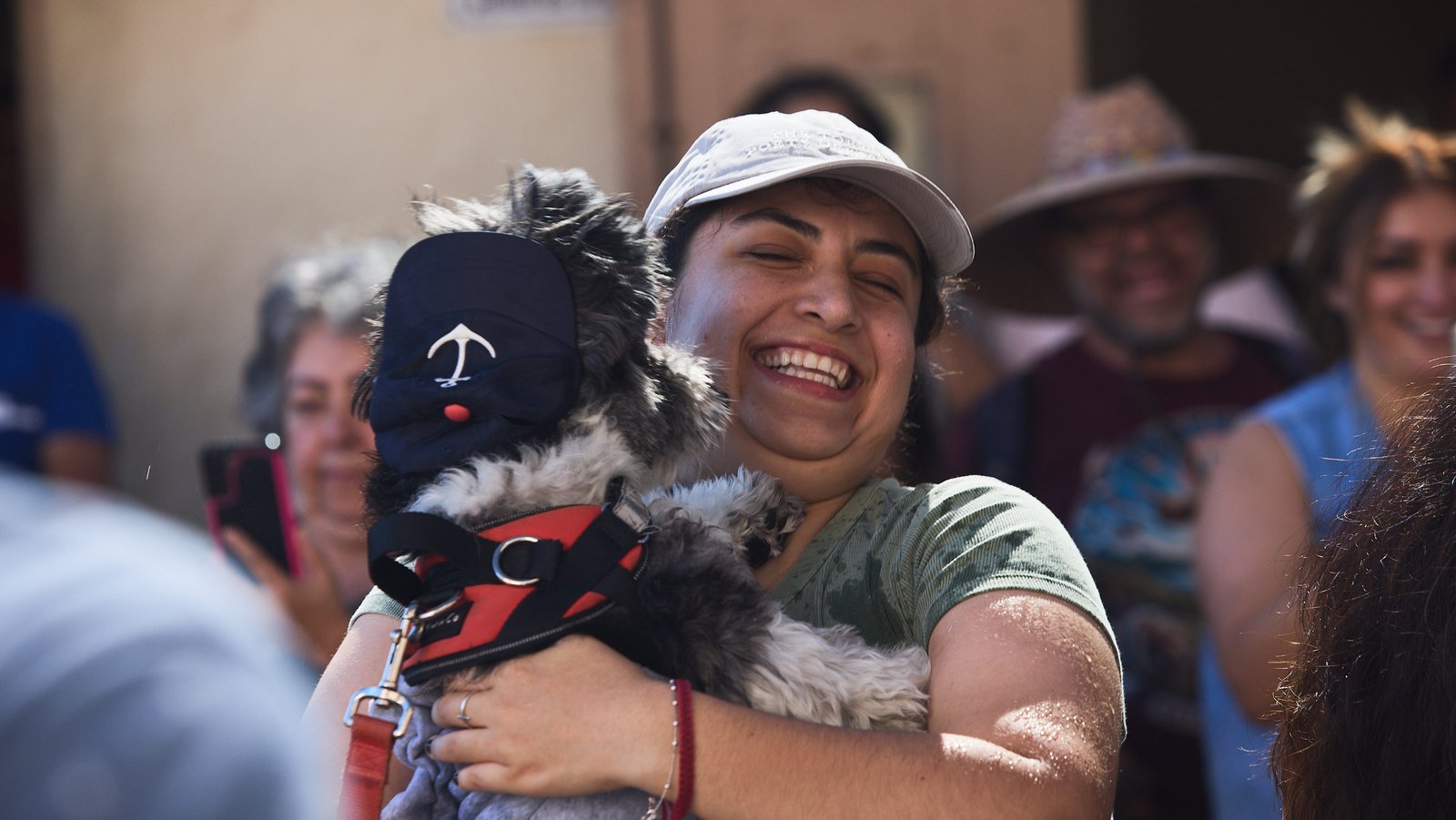 A parishioner reacts to her pet getting blessed during a special “Blessing of the Animals” event at at St. Francis of Assisi Church in Silver Lake on Oct. 4. (John Geronilla)