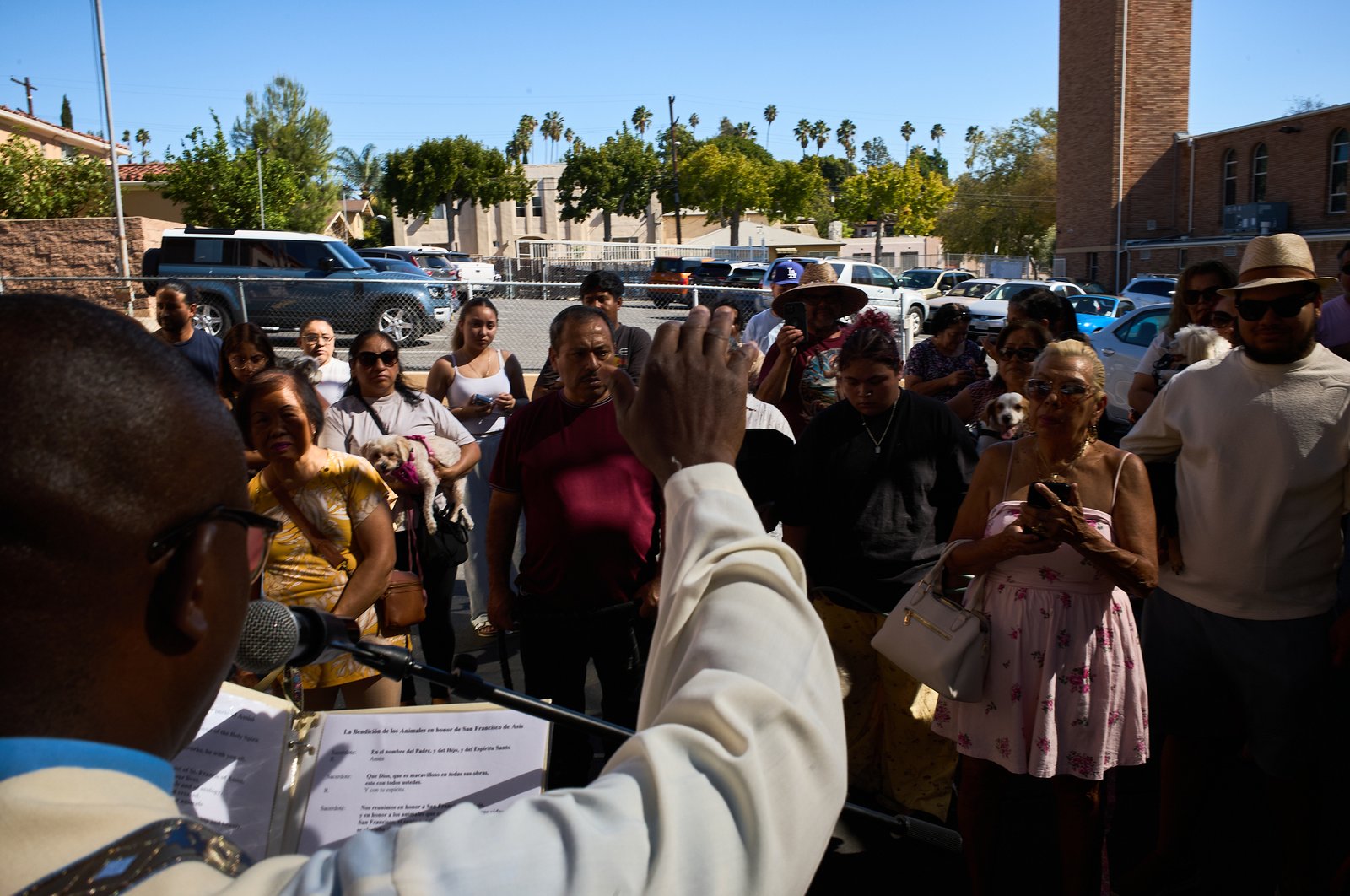 Father Chidi Ekpendu, pastor at St. Francis of Assisi Church in Silver Lake, celebrates the parish patron’s feast day with a special “Blessing of the Animals” after a special Mass and parish potluck on Oct. 4. (John Geronilla)