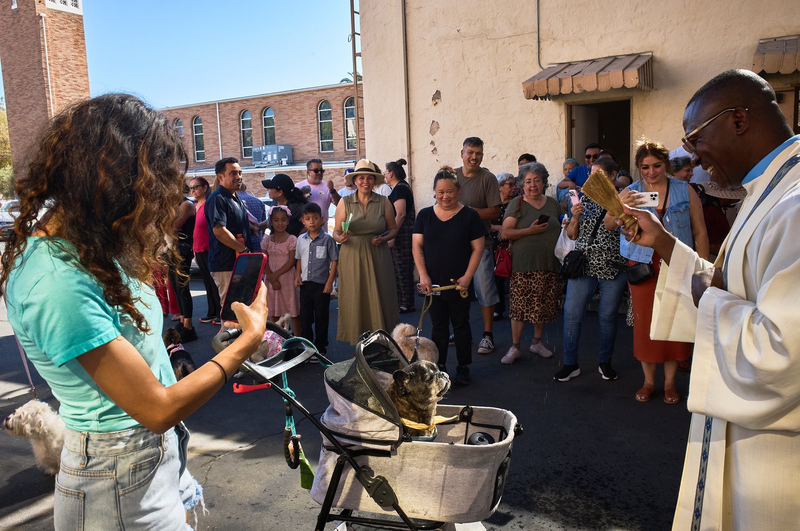 Father Chidi Ekpendu, pastor at St. Francis of Assisi Church in Silver Lake, celebrates the parish patron’s feast day with a special “Blessing of the Animals” after a special Mass and parish potluck on Oct. 4. (John Geronilla)