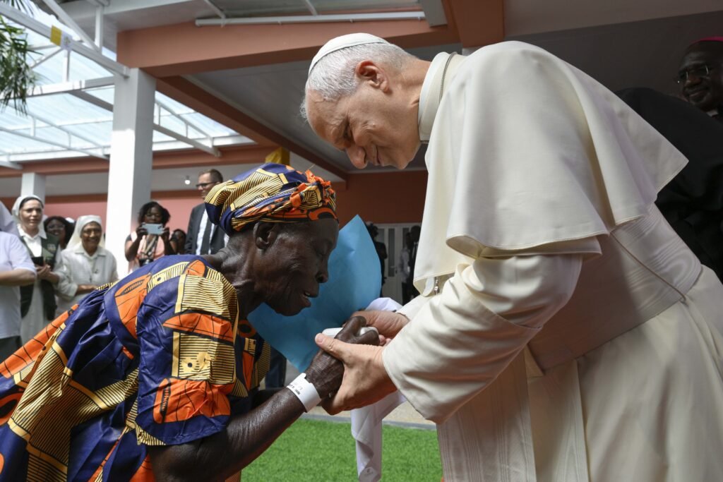 Pope Leo XIV greets an elderly woman during his visit to a care home in Saurimo, Angola, on 20 April 2026. (Photo: OSV News/Simone Risoluti, Vatican Media)