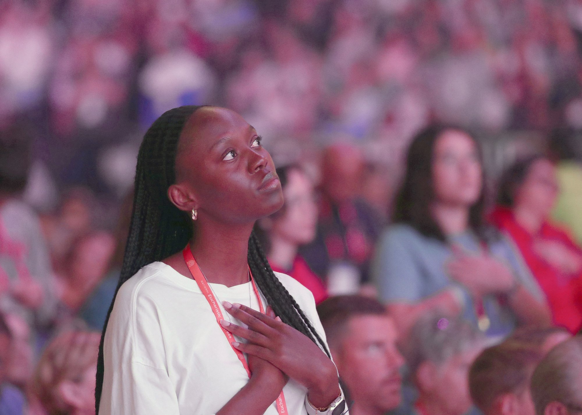 A young woman prays