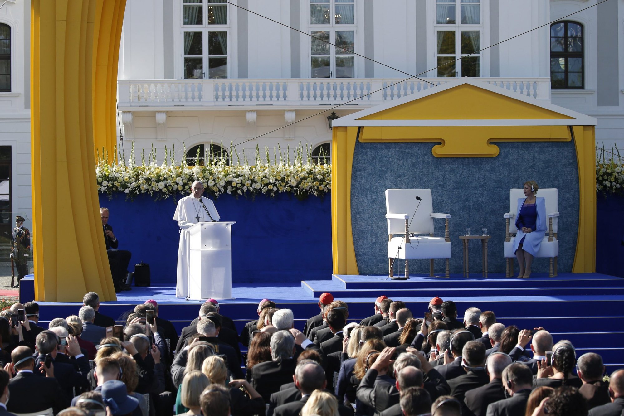 Pope Francis speaks during a meeting with government authorities, members of civil society and the diplomatic corps in the garden of the presidential palace in Bratislava, Slovakia, Sept. 13, 2021. At right is Slovak President Zuzana Caputová. (CNS photo/Paul Haring)