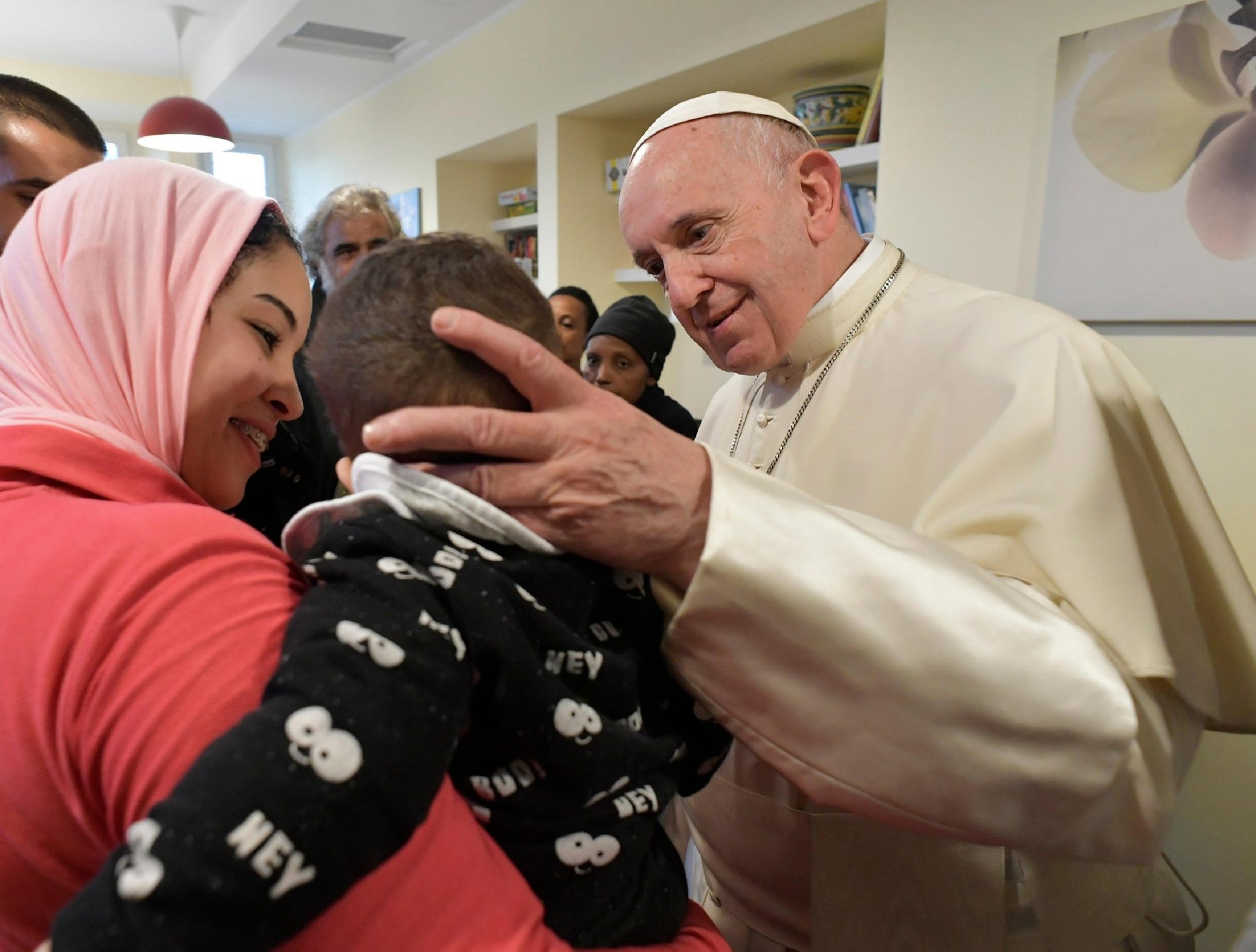 Pope Francis greets a child as he visits poor, sick people at a center run by the CasAmica Onlus organization on the outskirts of Rome in this Dec. 7, 2018, file photo. In his message for the 2023 World Day of the Sick, the pope said the way we treat those who are ill shows exactly what kind of a community we are. (CNS photo/Vatican Media)