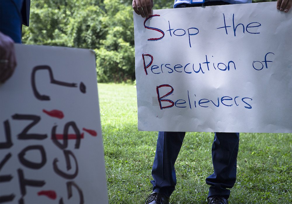 A participant holds a sign at a Religious Freedom Rally in Washington July 10