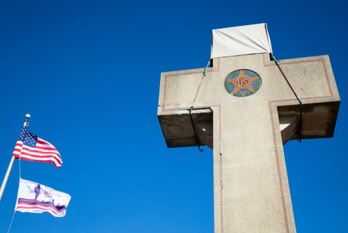 View of the American Flag and the 100th anniversary Flag at the World War I Memorial commissioned by the American Legion built 1919-1925 on Alt Rt 1.