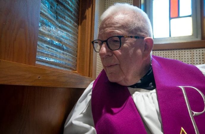 Father Lawrence C. Goode hears confession May 8