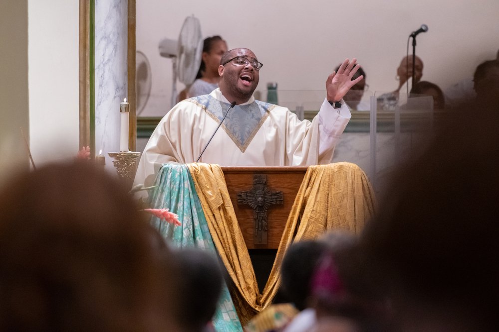 Father Kareem Smith of the Archdiocese of New York delivers the homily in Baltimore's historic St. Francis Xavier Church July 22