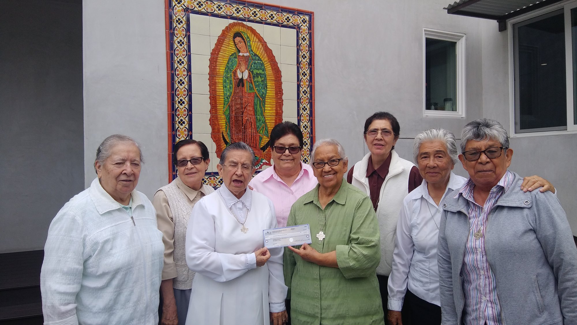 Missionary Guadalupanas of the Holy Spirit accept their grant from board member John Coleman. (PHOTO COURTESY SOAR!)