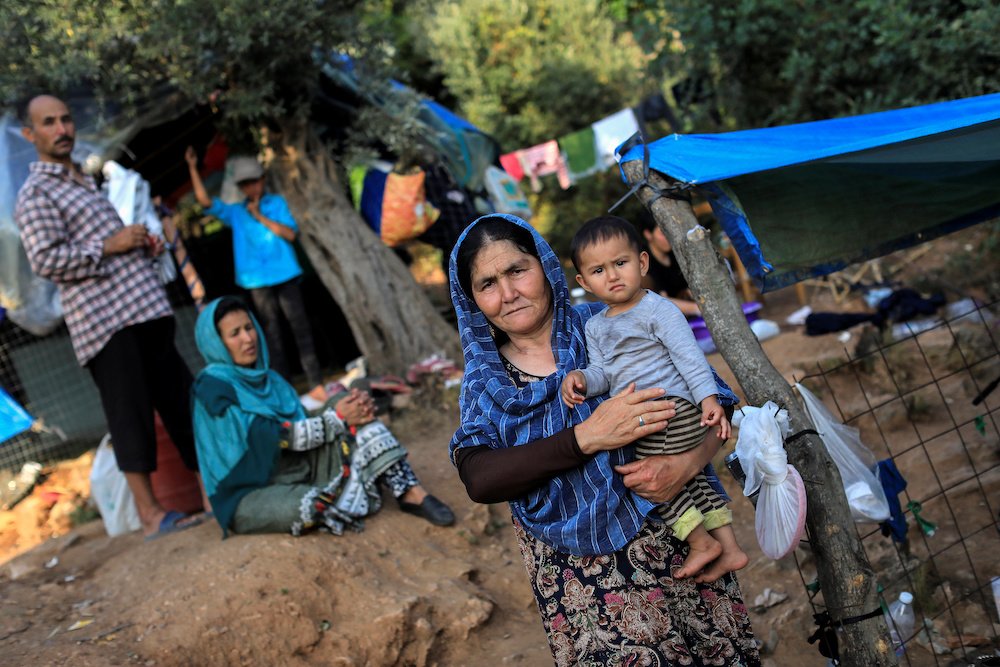 Refugees from Afghanistan are seen at a makeshift camp in Samos