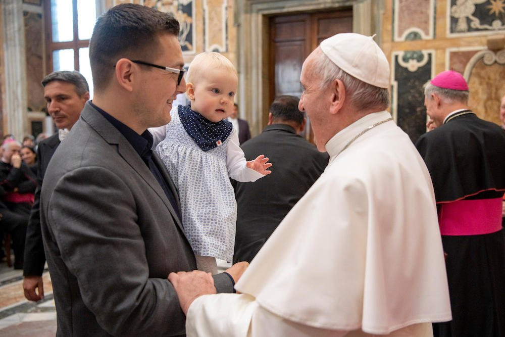 Pope Francis greets family members during an audience with participants attending an international conference of pro-life and medical leaders