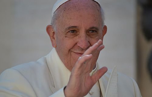 Pope Francis greets pilgrims in Saint Peter's Square during his general audience on April 16