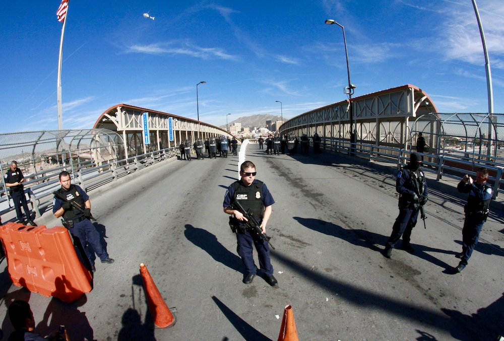 U.S. Customs and Border Protection officers and other armed federal agents temporarily close a bridge at a border crossing to conduct a military training drill Oct. 29. Some local organizations worried it signaled increasing militarization and possible use of violence against migrants on the border. President Donald Trump […]