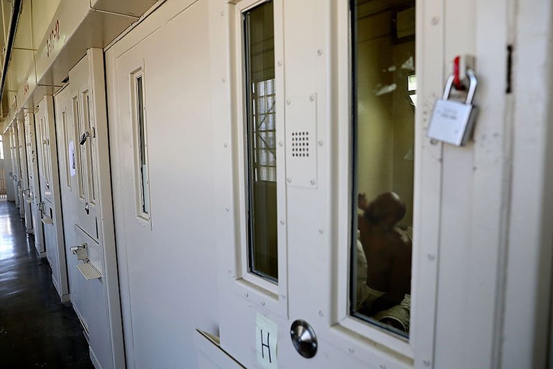 A condemned inmate eats in his cell at San Quentin State Prison's death row adjustment center on August 15