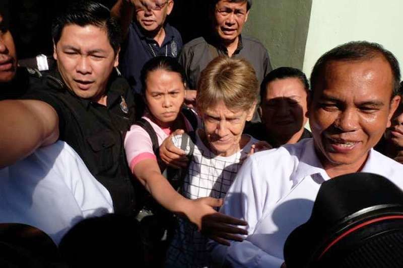 Sr. Patricia Fox walks free from the Bureau of Immigration office in Manila where she was held April 17