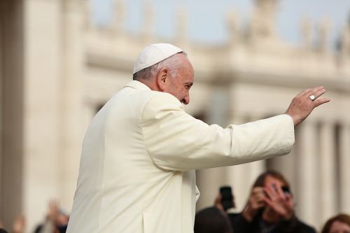 Pope Francis waves at the general audience in St. Peter's Square