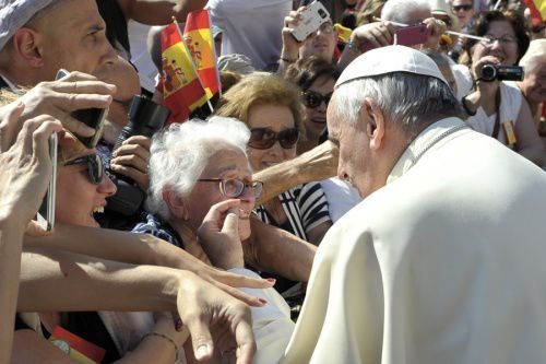 Pope Francis greets an elderly woman at the Wednesday general audience in St. Peter's Square on June 3