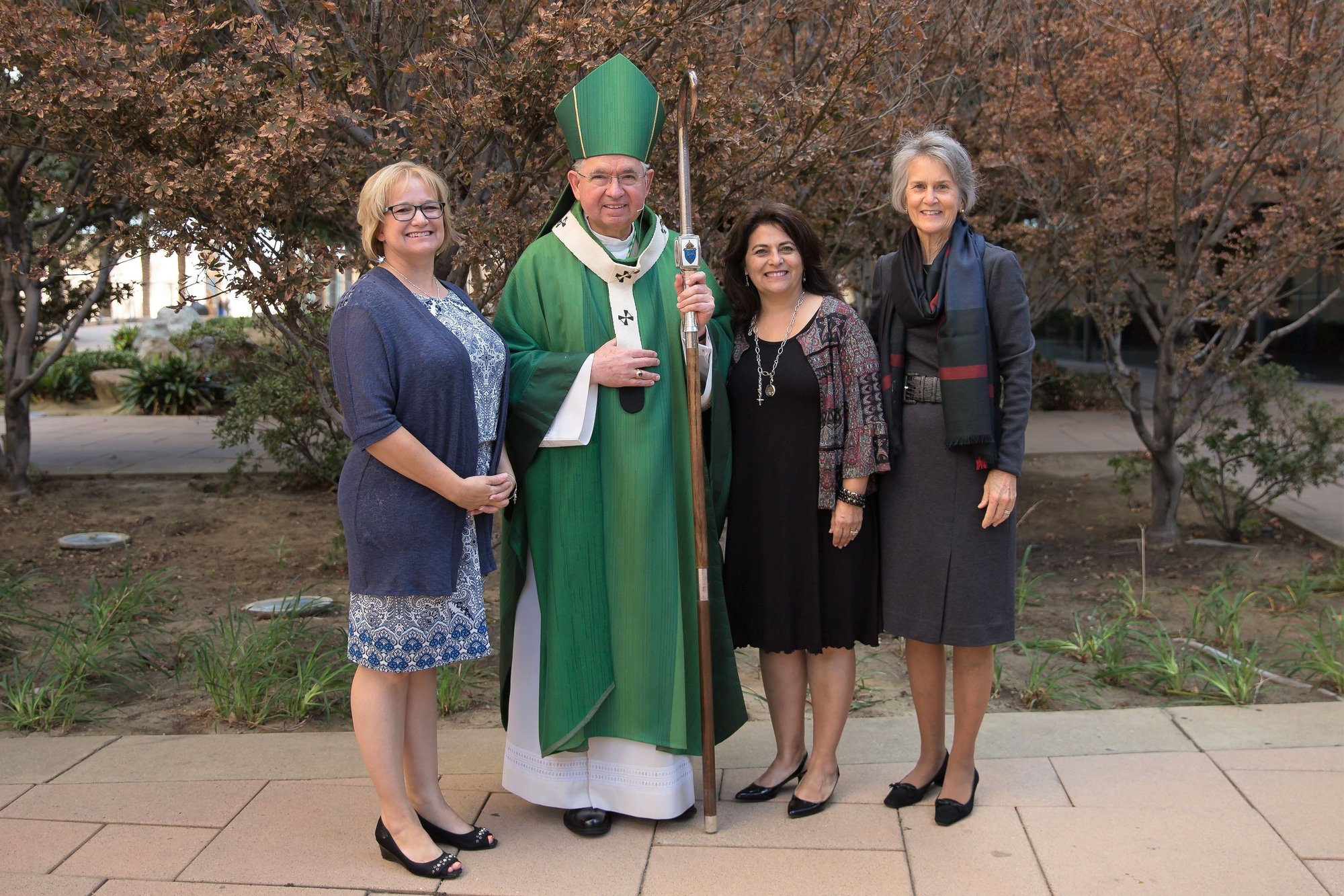 New pastoral associates Katie Tassinari (left) and Suzette Sornborger (second from right) are pictured with Archbishop José H. Gomez and Katherine Enright