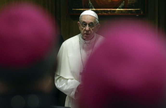 Pope Francis arrives at the annual Bishops' Conference in the Synod hall at the Vatican